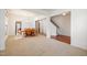 Open-concept dining room with new paint, carpet, and hardwood-style flooring at 2344 Lazy River Dr, Raleigh, NC 27610