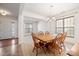 Inviting dining area with wood table, chandelier, and large window for natural light at 2344 Lazy River Dr, Raleigh, NC 27610