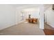 Bright, open-concept dining room featuring neutral carpet and abundant natural light at 2344 Lazy River Dr, Raleigh, NC 27610