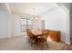 Dining room featuring new carpet, window with blinds, and a wooden buffet at 2344 Lazy River Dr, Raleigh, NC 27610