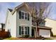 Well-maintained two-story home with green shutters and a manicured lawn at 2344 Lazy River Dr, Raleigh, NC 27610