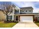 Charming two-story home featuring a two car garage and manicured front lawn at 2344 Lazy River Dr, Raleigh, NC 27610