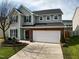 Charming two-story home with a two car garage, shutters, and landscaped front yard at 2344 Lazy River Dr, Raleigh, NC 27610