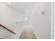 Long hallway with a window provides a glimpse of the outside at 2344 Lazy River Dr, Raleigh, NC 27610