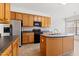 Bright kitchen with stainless steel refrigerator and plenty of storage at 2344 Lazy River Dr, Raleigh, NC 27610