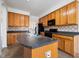 Kitchen island featuring a double sink and ample counter space at 2344 Lazy River Dr, Raleigh, NC 27610