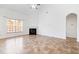 Bright living room features fireplace, high ceiling, and large window at 2344 Lazy River Dr, Raleigh, NC 27610