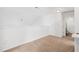 Loft with neutral carpet and fresh paint leading to bathroom at 2344 Lazy River Dr, Raleigh, NC 27610