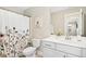 Well-lit bathroom featuring a modern vanity, toilet, stylish shower curtain and wall art at 2515 Maplemere Ct, Durham, NC 27703