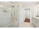 Modern bathroom featuring a glass shower with rainfall shower head and tiled walls at 2515 Maplemere Ct, Durham, NC 27703