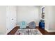 Bright bonus room features two bean bag chairs, a large window, and an airplane themed bookshelf at 2515 Maplemere Ct, Durham, NC 27703