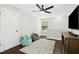 Bright bonus room with ceiling fan, two bean bag chairs, and luxury vinyl flooring at 2515 Maplemere Ct, Durham, NC 27703