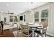 Bright dining area with natural light, stylish light fixture, and connection to the living room at 2515 Maplemere Ct, Durham, NC 27703