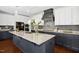 Beautiful kitchen featuring an island with granite countertops, stylish cabinets, and modern fixtures at 2515 Maplemere Ct, Durham, NC 27703