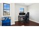 Bright home office space features two windows, carpet flooring, and a comfortable desk setup at 2515 Maplemere Ct, Durham, NC 27703