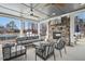 Relaxing outdoor lounge area with a stone fireplace and comfortable seating, perfect for socializing at 2515 Maplemere Ct, Durham, NC 27703
