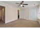 Bedroom featuring three closets, carpet floors and neutral paint at 2835 Bedfordshire Ct, Raleigh, NC 27604