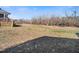 Expansive backyard featuring mature trees and plenty of space for outdoor activities at 285 Scotland Dr, Youngsville, NC 27596