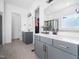 Modern bathroom with double vanities, sleek fixtures, and neutral tile flooring at 285 Scotland Dr, Youngsville, NC 27596