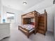 A bedroom features a wooden bunk bed with attached drawers and storage space at 285 Scotland Dr, Youngsville, NC 27596