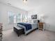 Cozy bedroom with large windows for natural light, complete with a stylish upholstered bench and soft blue accents at 285 Scotland Dr, Youngsville, NC 27596
