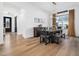 Elegant dining room with dark wood table and modern light fixture at 285 Scotland Dr, Youngsville, NC 27596