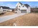 Charming two-story home with a long driveway at 285 Scotland Dr, Youngsville, NC 27596