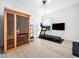 Bright and well-equipped home gym with wood-look floors, a modern sauna, and exercise equipment at 285 Scotland Dr, Youngsville, NC 27596