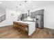 Spacious kitchen features stainless steel appliances, an island with barstool seating, and gray cabinets for modern living at 285 Scotland Dr, Youngsville, NC 27596