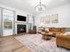 Inviting living room features a cozy fireplace and lots of natural light at 285 Scotland Dr, Youngsville, NC 27596