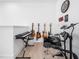 A well-appointed music room is equipped with guitars, a keyboard, and an electric drum set for the musically inclined at 285 Scotland Dr, Youngsville, NC 27596