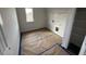 Well-lit laundry room with white wire shelving and utility connections at 30 Olivia Crossing Ct, Smithfield, NC 27577