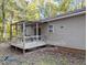 A covered back deck, a perfect place for outdoor relaxation and entertainment at 3011 Little Creek Ln, Hillsborough, NC 27278