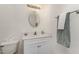 Bright bathroom featuring a white vanity, oval mirror, and a neutral color scheme at 3011 Little Creek Ln, Hillsborough, NC 27278