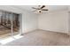 Bright bedroom with sliding doors and a ceiling fan at 3011 Little Creek Ln, Hillsborough, NC 27278
