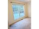 Bedroom with neutral walls, carpet, and a large window at 3011 Little Creek Ln, Hillsborough, NC 27278