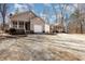 Charming homes with a large gravel driveway and well-maintained lawns offer a welcoming curb appeal at 3011 Little Creek Ln, Hillsborough, NC 27278