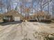 Charming homes with a large gravel driveway and well-maintained lawns offer a welcoming curb appeal at 3011 Little Creek Ln, Hillsborough, NC 27278