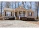 A quaint single-Gathering home with a charming front porch and shuttered windows at 3011 Little Creek Ln, Hillsborough, NC 27278
