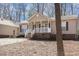 Inviting single-story home with covered porch and well-maintained landscaping at 3011 Little Creek Ln, Hillsborough, NC 27278