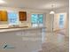 Bright kitchen area with a breakfast bar overlooking a sliding glass door at 3011 Little Creek Ln, Hillsborough, NC 27278