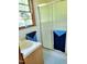 Bathroom featuring a wood vanity with a shower and a window that offers outdoor views at 323 Ranch Farm Rd, Raleigh, NC 27603