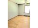 Spacious bedroom with hardwood floors, ceiling fan, and light-colored walls at 323 Ranch Farm Rd, Raleigh, NC 27603