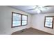 Bedroom features a ceiling fan and natural light from the two windows at 323 Ranch Farm Rd, Raleigh, NC 27603