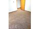 View of a carpeted bedroom that has a door to the hallway at 323 Ranch Farm Rd, Raleigh, NC 27603