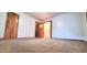 Bedroom features a large closet, natural light, and neutral colored carpet at 323 Ranch Farm Rd, Raleigh, NC 27603