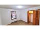 Bright bedroom featuring carpet, a window, and a wood closet at 323 Ranch Farm Rd, Raleigh, NC 27603