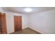 Cozy bedroom with carpet and a door to the hallway at 323 Ranch Farm Rd, Raleigh, NC 27603