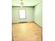 Empty bedroom featuring light-colored walls, hardwood floors, and a ceiling fan at 323 Ranch Farm Rd, Raleigh, NC 27603