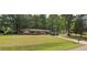 Attractive brick home with a spacious front yard, offering ample space for outdoor activities and curb appeal at 323 Ranch Farm Rd, Raleigh, NC 27603